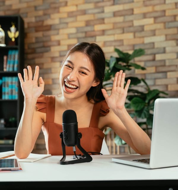cheerful-blogger-using-mic-for-podcast-2021-09-04-03-50-50-utc.jpg